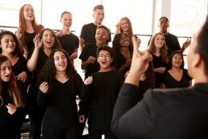 Students participating in group singing class