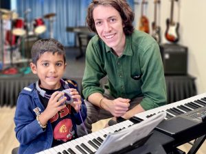 Student choosing between singing and playing instrument