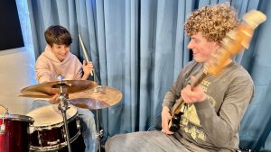 kids having fun playing drums