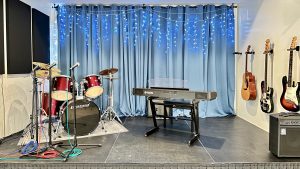 Student practicing drums at home
