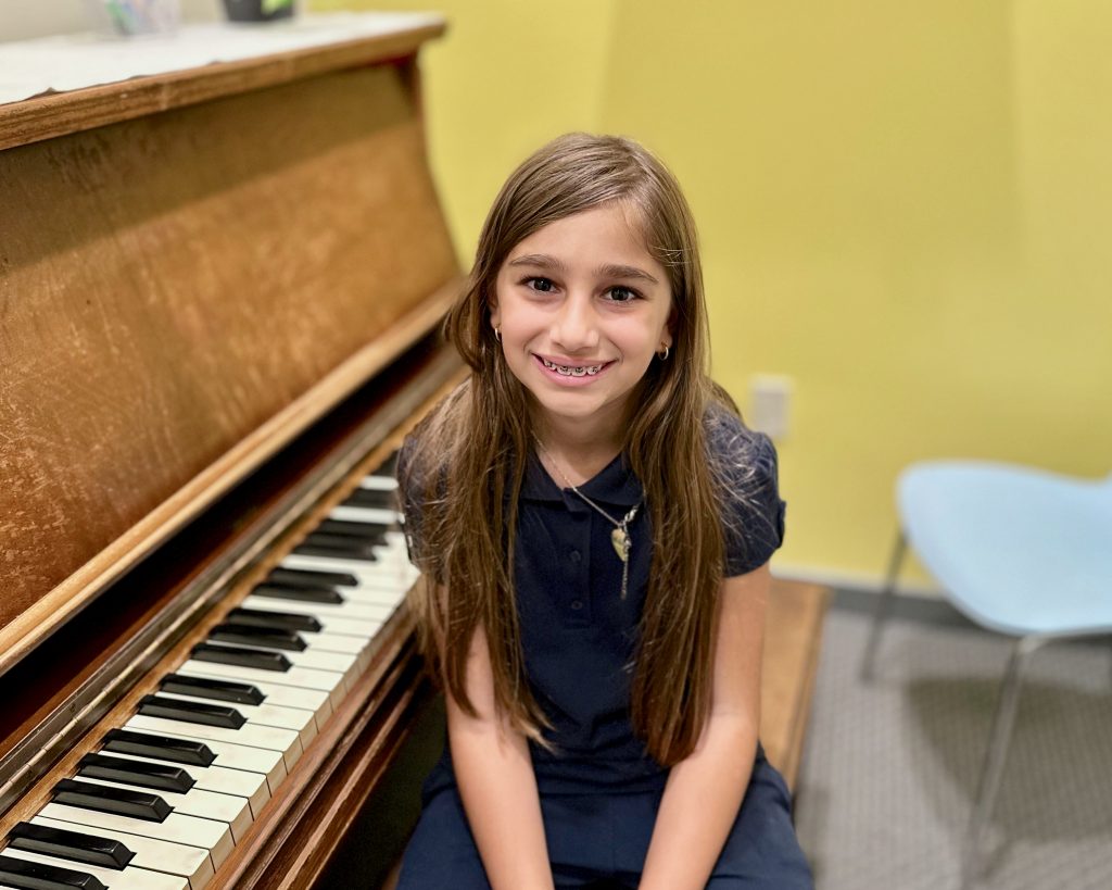 young kid in piano lessons